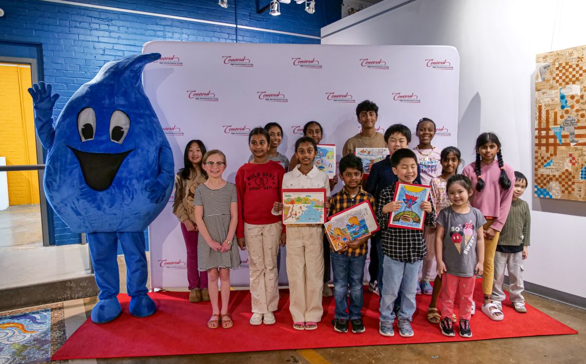 Drippy, the water drop mascot, with the 2025 Stormwater Art Contest participants Drippy, the water drop mascot, with the 2025 Stormwater Art Contest participants